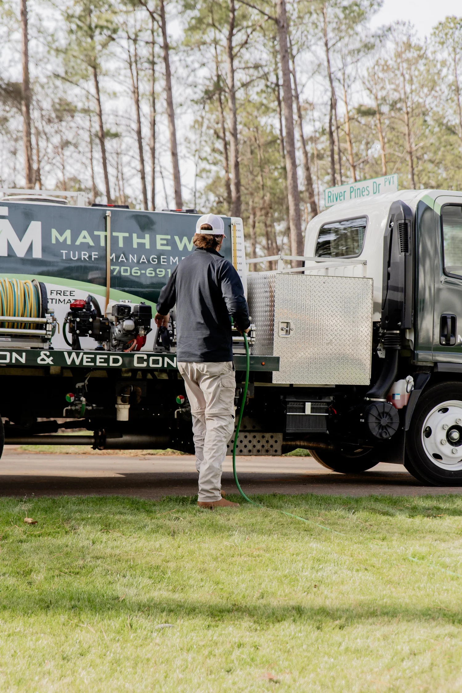 Matthews Turf Management service truck in a local neighborhood